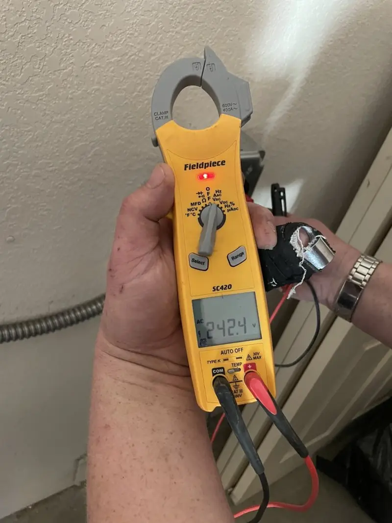 Voltage testing with clamp meter during Generator Installation in Colton